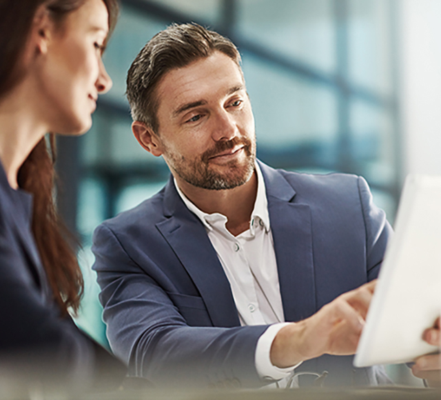 Teamwork, tablet and planning with businesspeople in the office for research on employee benefit solutions. Collaboration, technology and brainstorming with a corporate team talking about strategy at work.